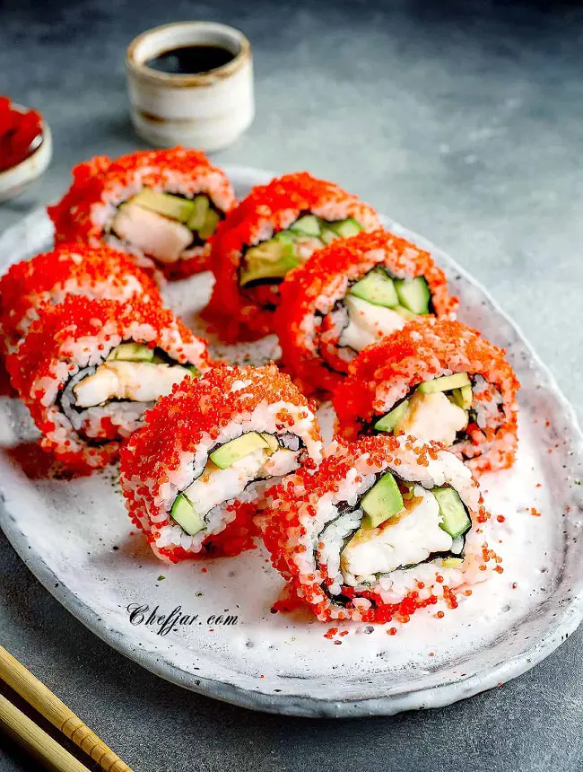 Boston Roll is filled with poached shrimp, avocado, cucumber and is rolled in nori