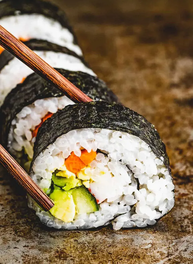 Maki Sushi is a medium sized roll and wrapped tightly in a nori seaweed